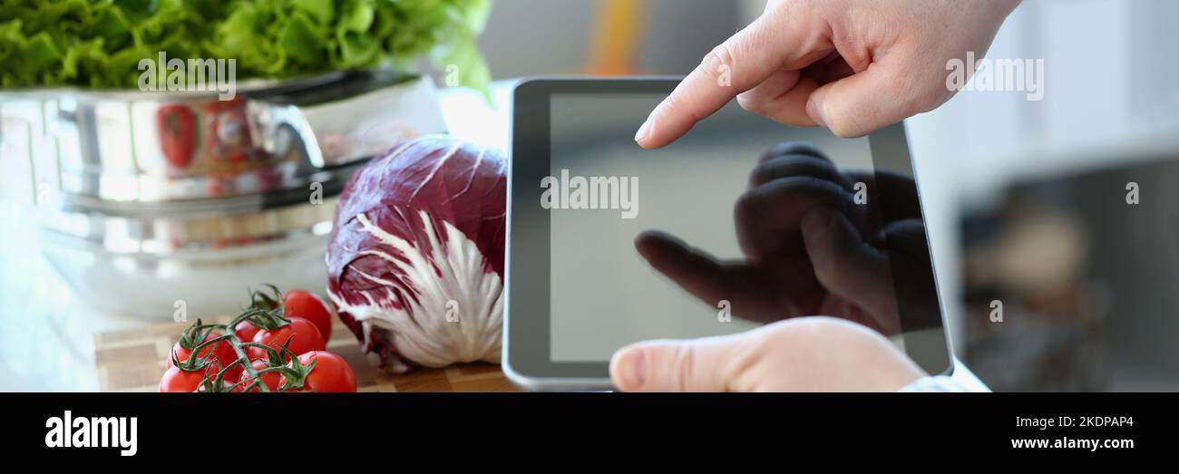 Vlogger chef showing ripe vegetables ingredients, video for culinary vlog Stock Photo
