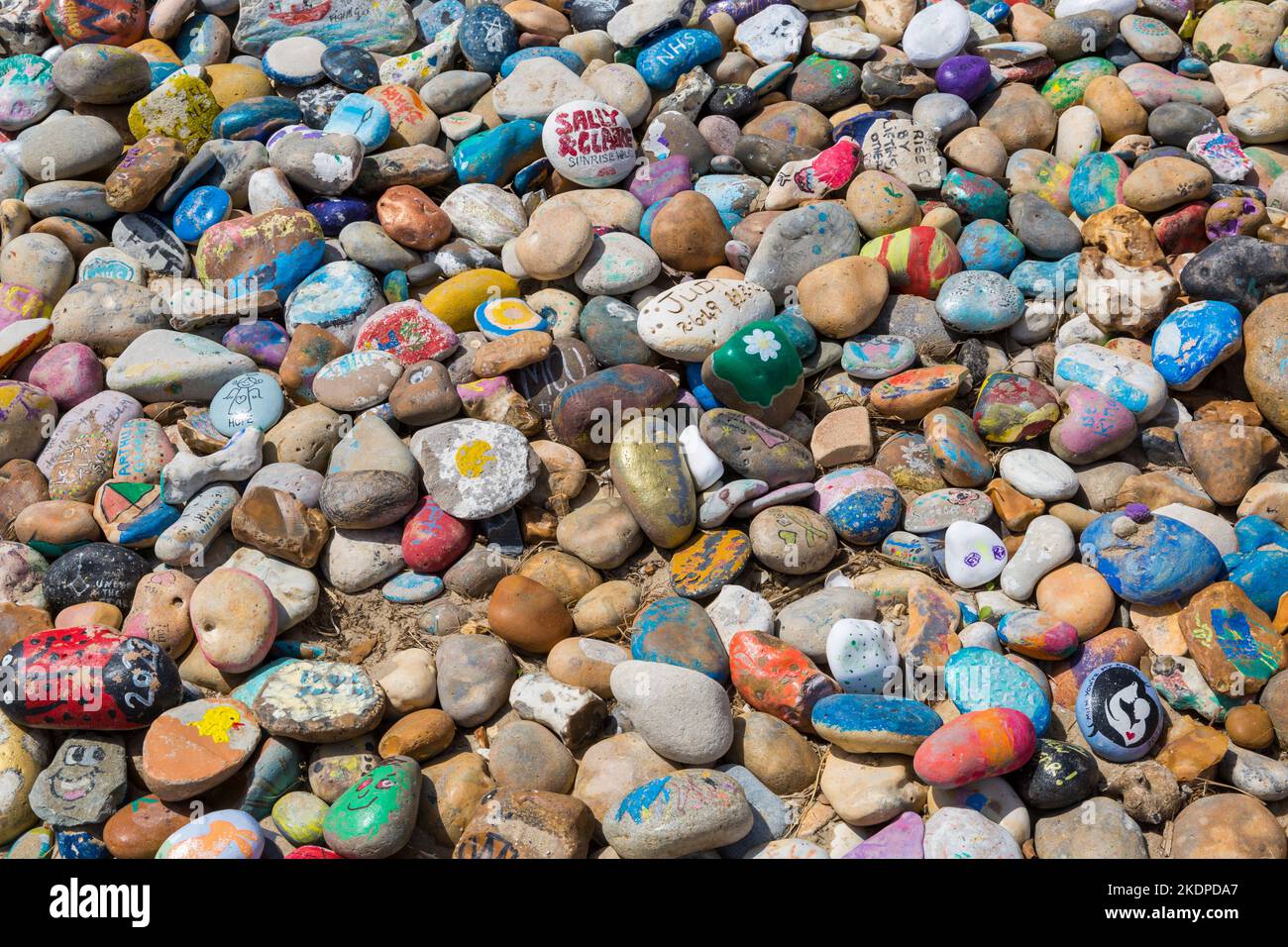 Avon Beach pebbles - painted pebbles on Avon Beach, Mudeford, Christchurch, Dorset UK in June Stock Photo