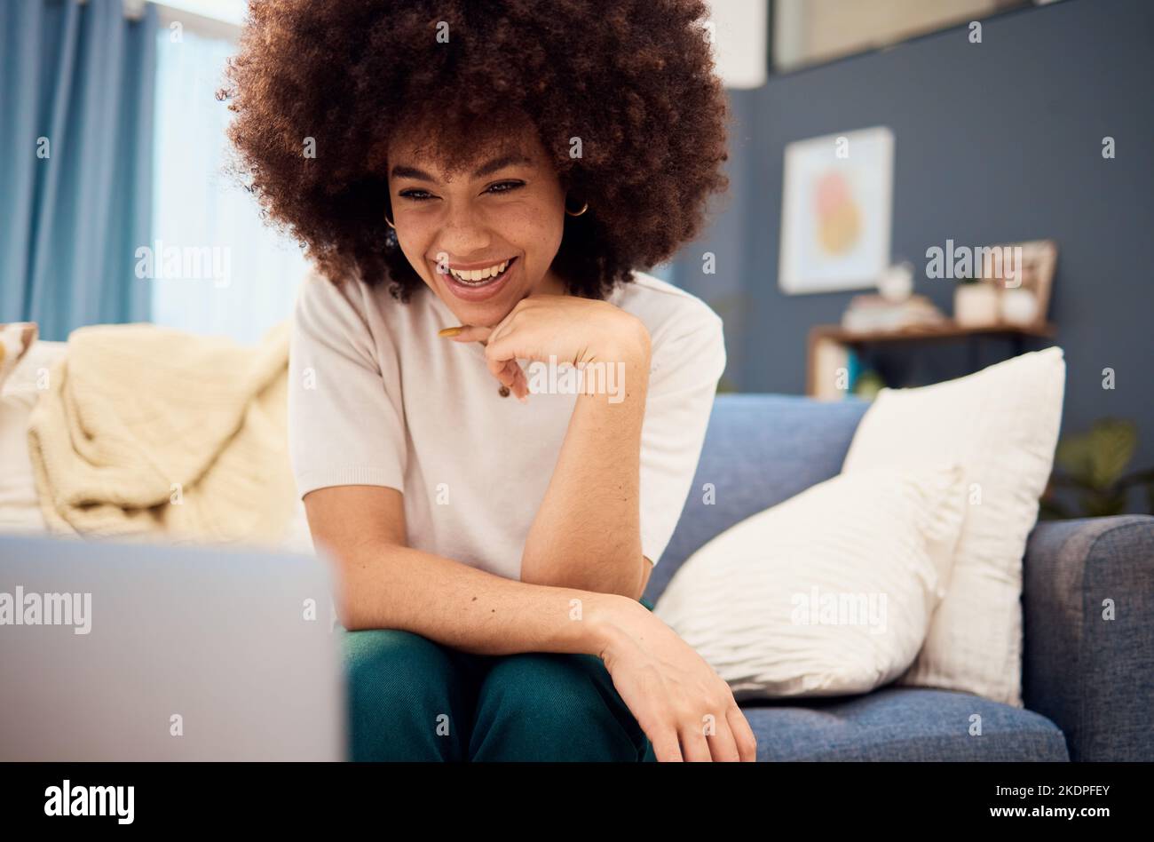 Black woman in living room, laptop and video call, download movies and ...