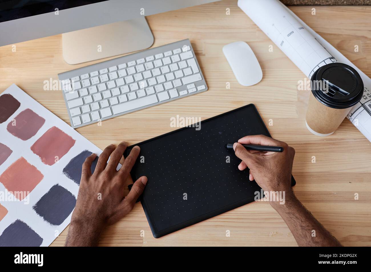 Top view of male designer using pen tablet at workplace, copy space ...