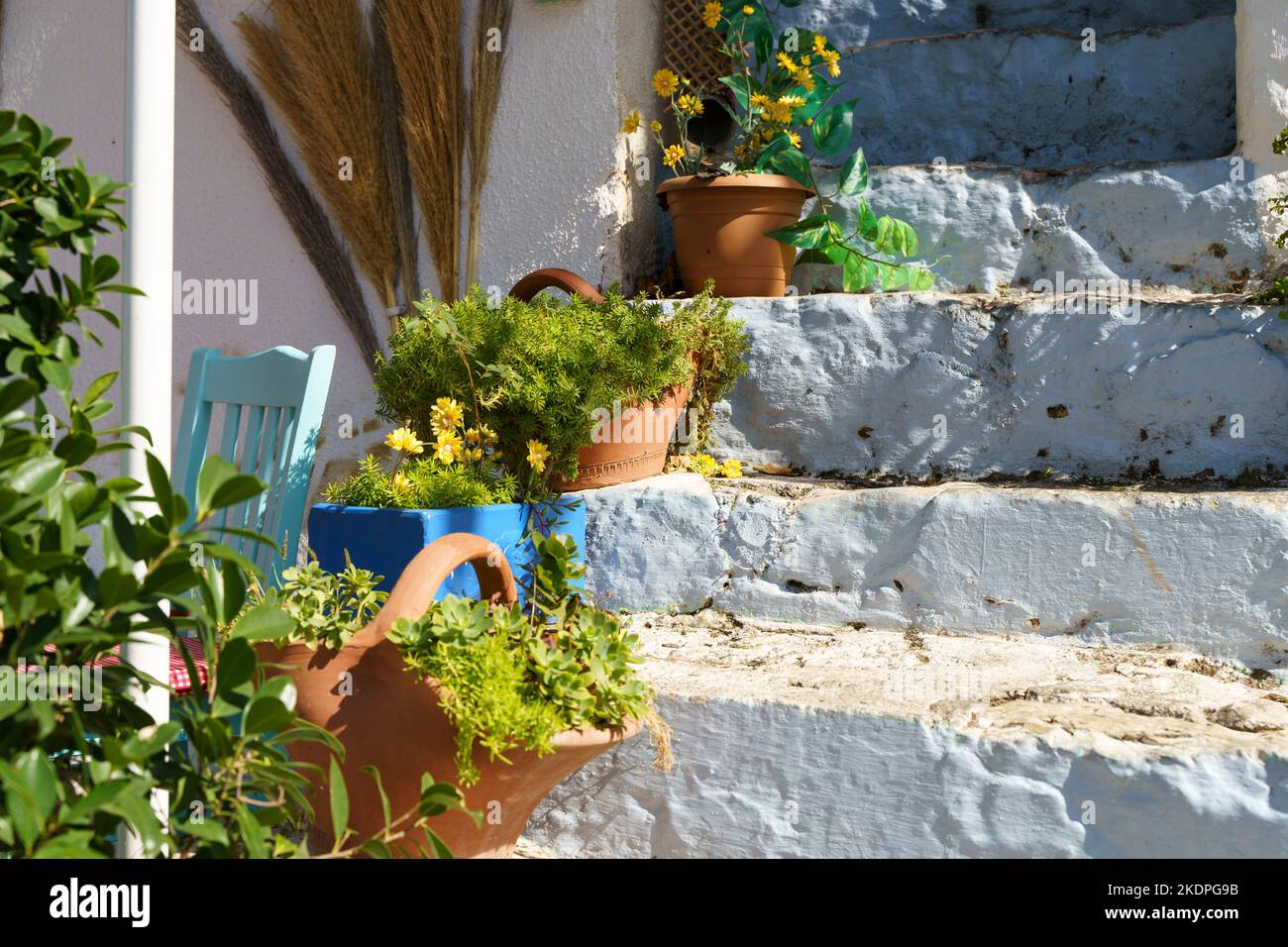 Design and decoration with flower plants in pots. Beautiful house exterior decor with summer flowers idea. High quality photo Stock Photo