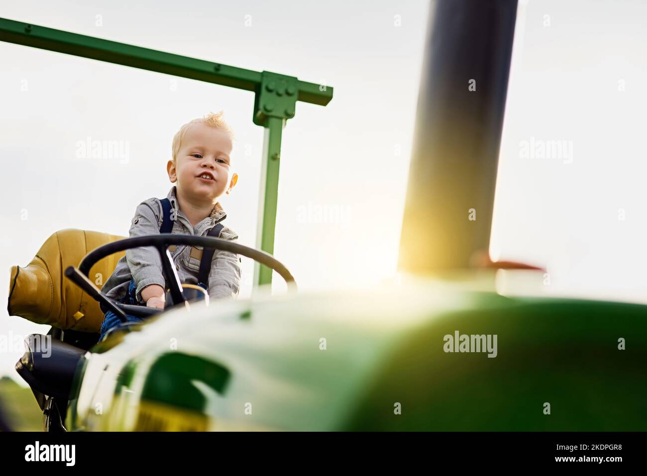 Old Macdonald Had A Son An Adorable Little Boy Riding A Tractor On A Farm Stock Photo Alamy Old Macdonald Had A Son An Adorable Little Boy Riding A Tractor On A Farm Stock Photo Alamy