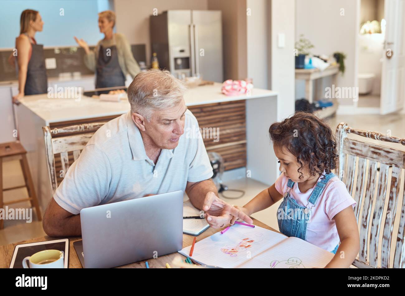 Learning, girl drawing and grandpa care in a kitchen remote working with a kid at home. Family, creative coloring and youth education development of a Stock Photo