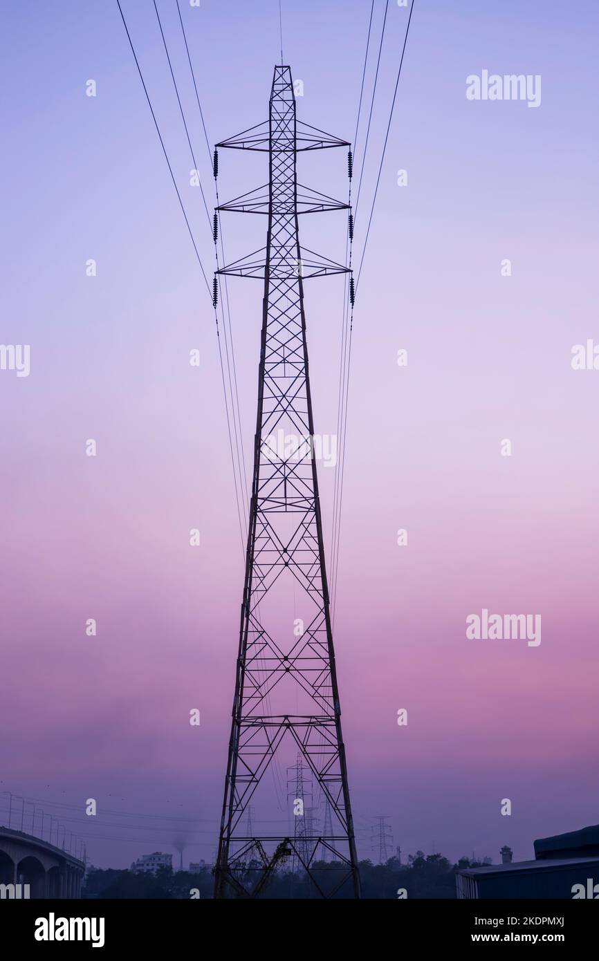 High voltage Electricity pylon under the cloudy blue sky Stock Photo ...