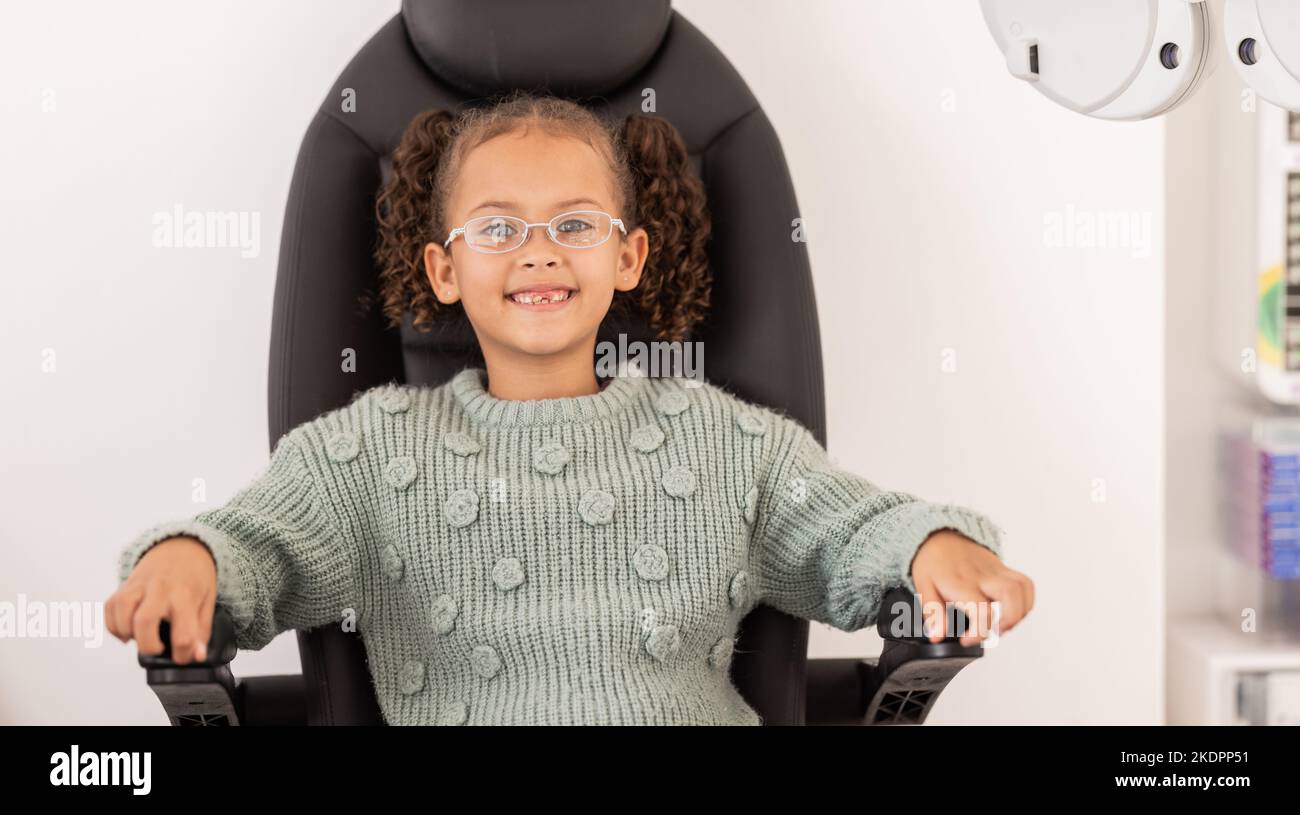 Girl child, eye test glasses and smile in portrait at optometrist