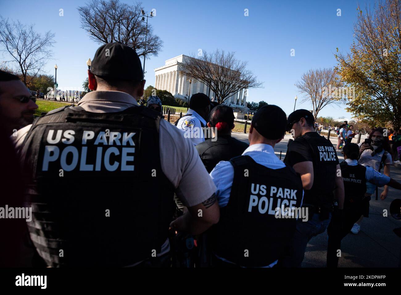 US Park Police arrest a counter-protester at a 'Free Speech for Women' event at the Lincoln hosted by British anti-trans activist Kellie-Jay Keen and her group, Standing for Women. Keen and her group, Standing for Women hosted the event. Keen and the group object to gender-inclusive and -affirming policies, language, and sports. The event drew approximately 20 people, and a similar number of counter-protesters. It was unclear why the person was arrested, as counter-protesters had followed police directives to relocate to an area roughly 150 feet away from the event. Police did not respond t Stock Photo