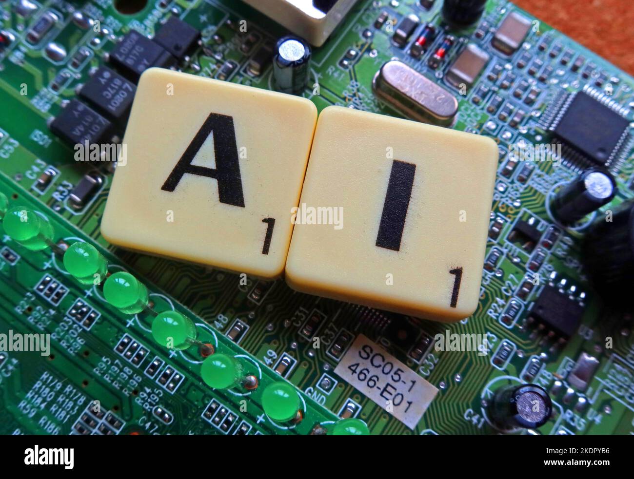 AI - artificial intelligence - Scrabble letters / word on a electronic PCB Stock Photo