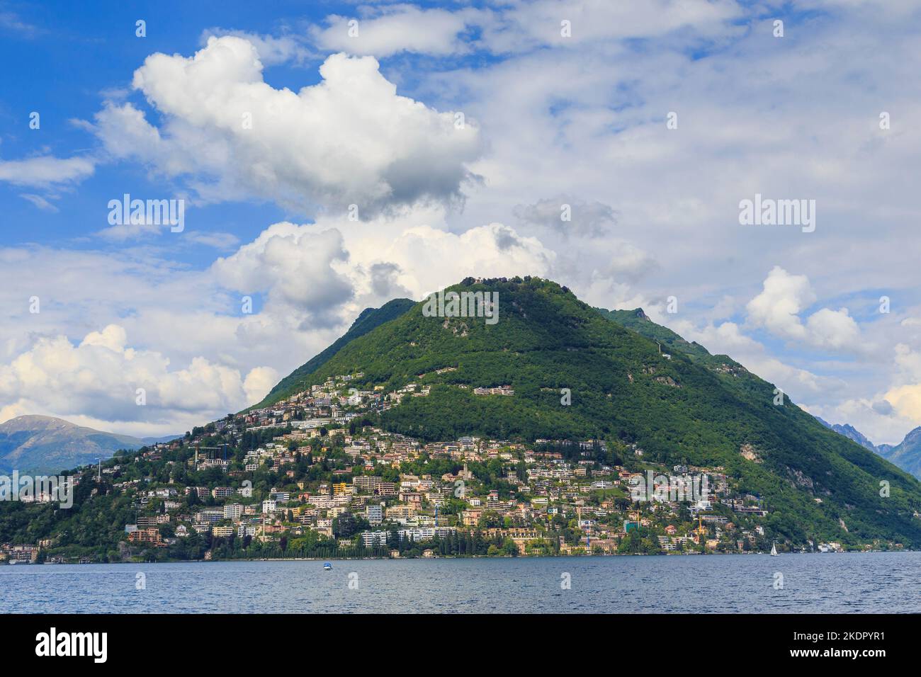 LUGANO, SWITZERLAND - MAY 12, 2018: It is a view of the Monte Bre mountain from Lake Lugano. Stock Photo
