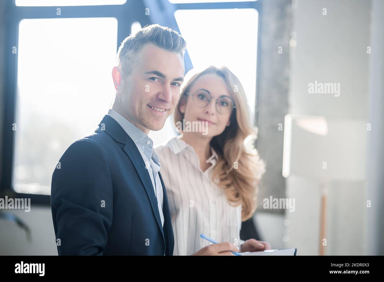 Elegant man and woman working together in the office Stock Photo