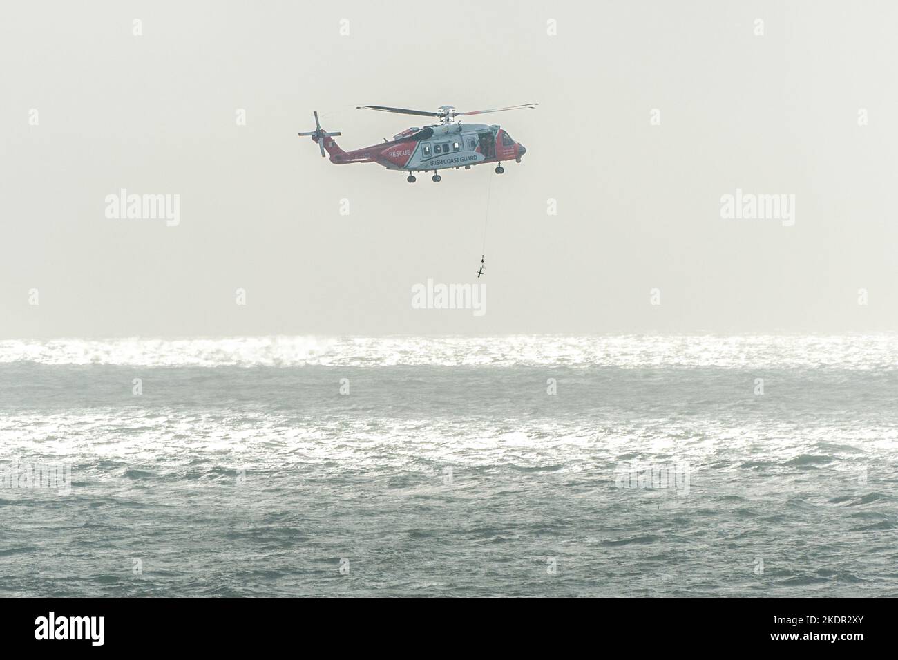 Tramore, Co. Waterford, Ireland. 8th Nov, 2022. The Irish Coastguard helicopter, Rescue 115, conducted a winching exercise in Tramore Bay this morning. The helicopter hovered for around 20 minutes during the exercise before flying back to its base at Waterford Airport. Credit: AG News/Alamy Live News Stock Photo