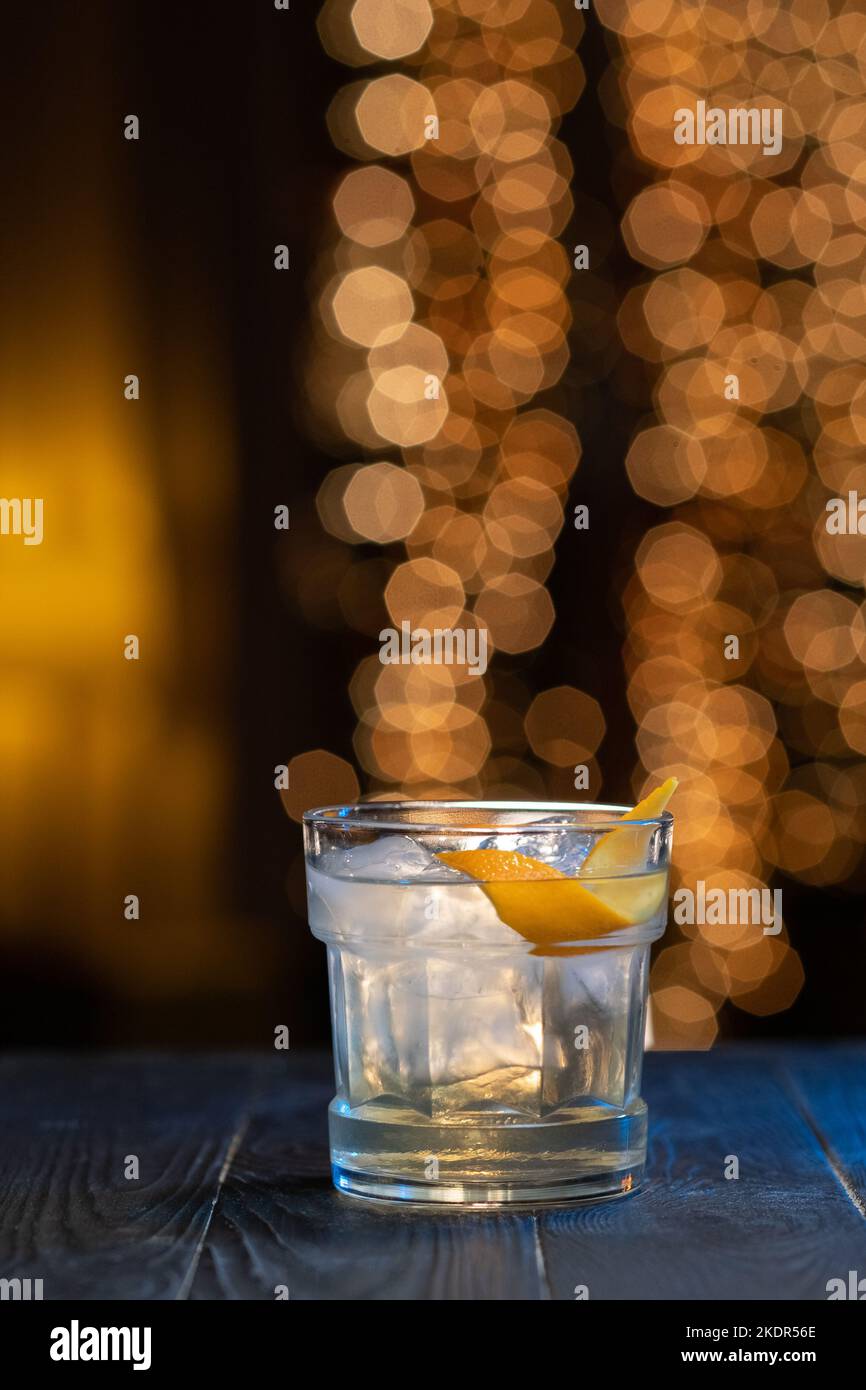 Martini with orange peel on bar counter Stock Photo Alamy
