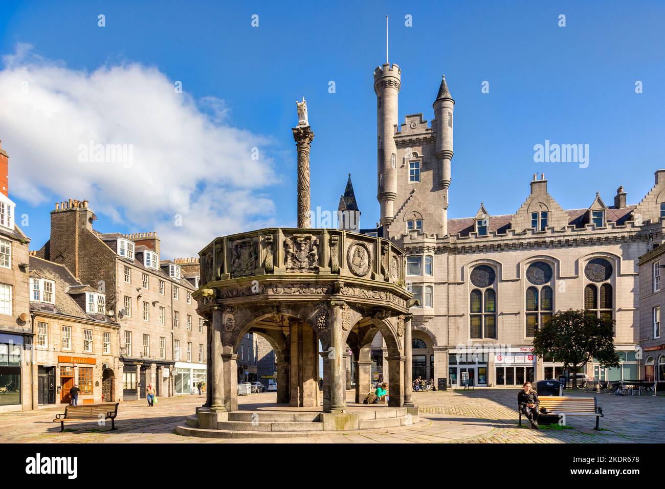 13 September 2022: Aberdeen, Scotland - The Market Cross, or Mercat Cross, in Castle Street. Behind are some of the granite buildings for which the ci Stock Photo