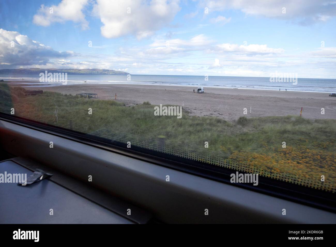 on the derry to belfast train passing benone beach derry londonderry northern ireland uk Stock Photo