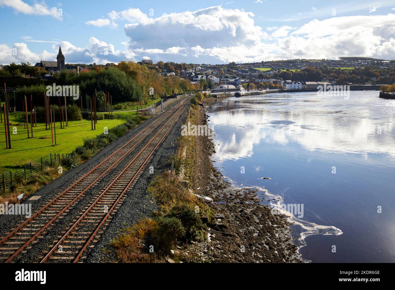 railway tracks along the river foyle leading to waterside train station derry londonderry northern ireland uk Stock Photo
