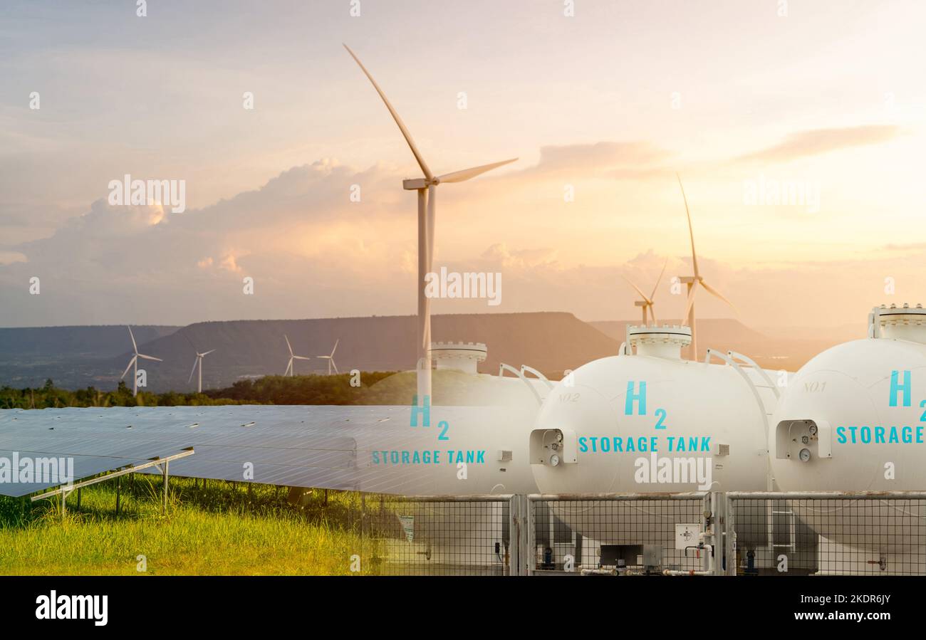 H2 fuel storage tank with green hydrogen concept. Sustainable renewable energy. Net zero emissions by 2050. Solar panel and wind turbine generate Stock Photo