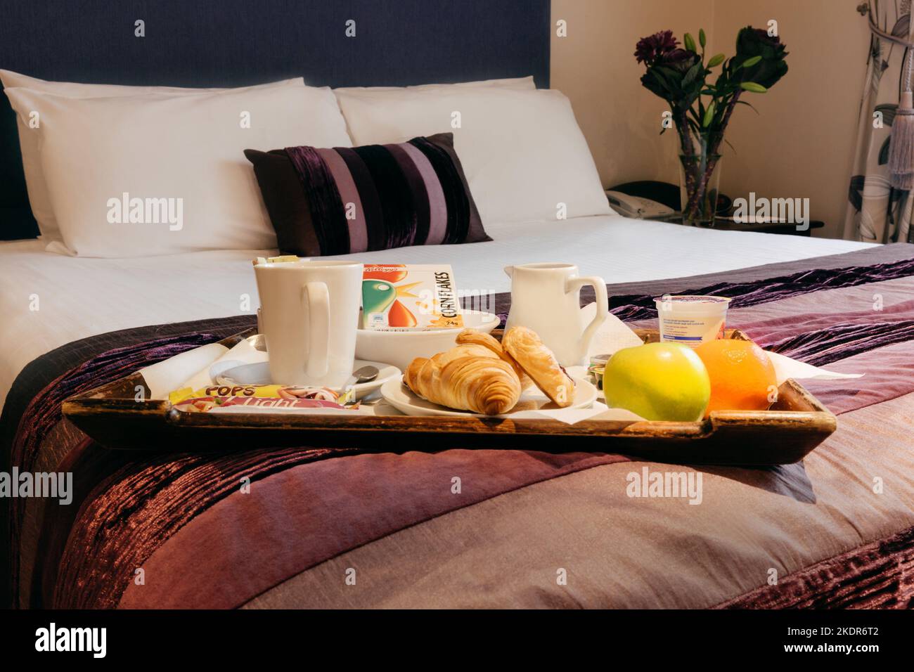 Continental breakfast in bed in hotel bedroom Stock Photo Alamy