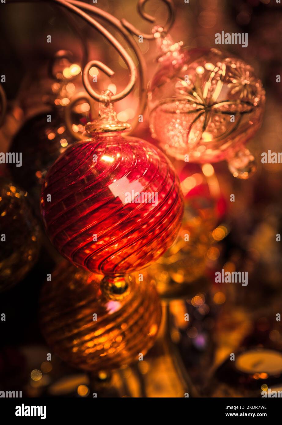 Beautiful artisan hand blown glass Christmas tree hanging baubles on sale at Bath Christmas Market. Stock Photo
