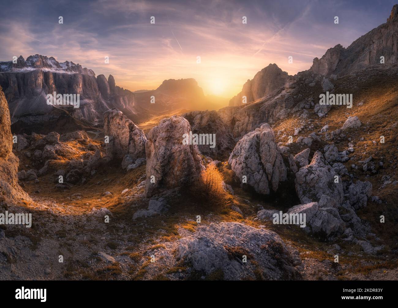 Rocks and stones at colorful sunset in autumn in Dolomites, Italy Stock Photo