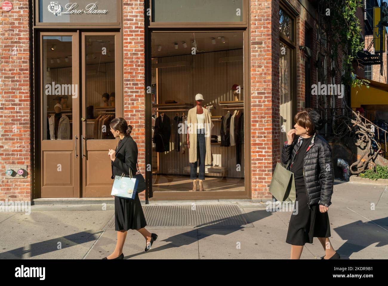 Shoppers pas the Loro Piana boutique in the Meatpacking district in New York on Sunday, October 30, 2022. (© Richard B. Levine) Stock Photo