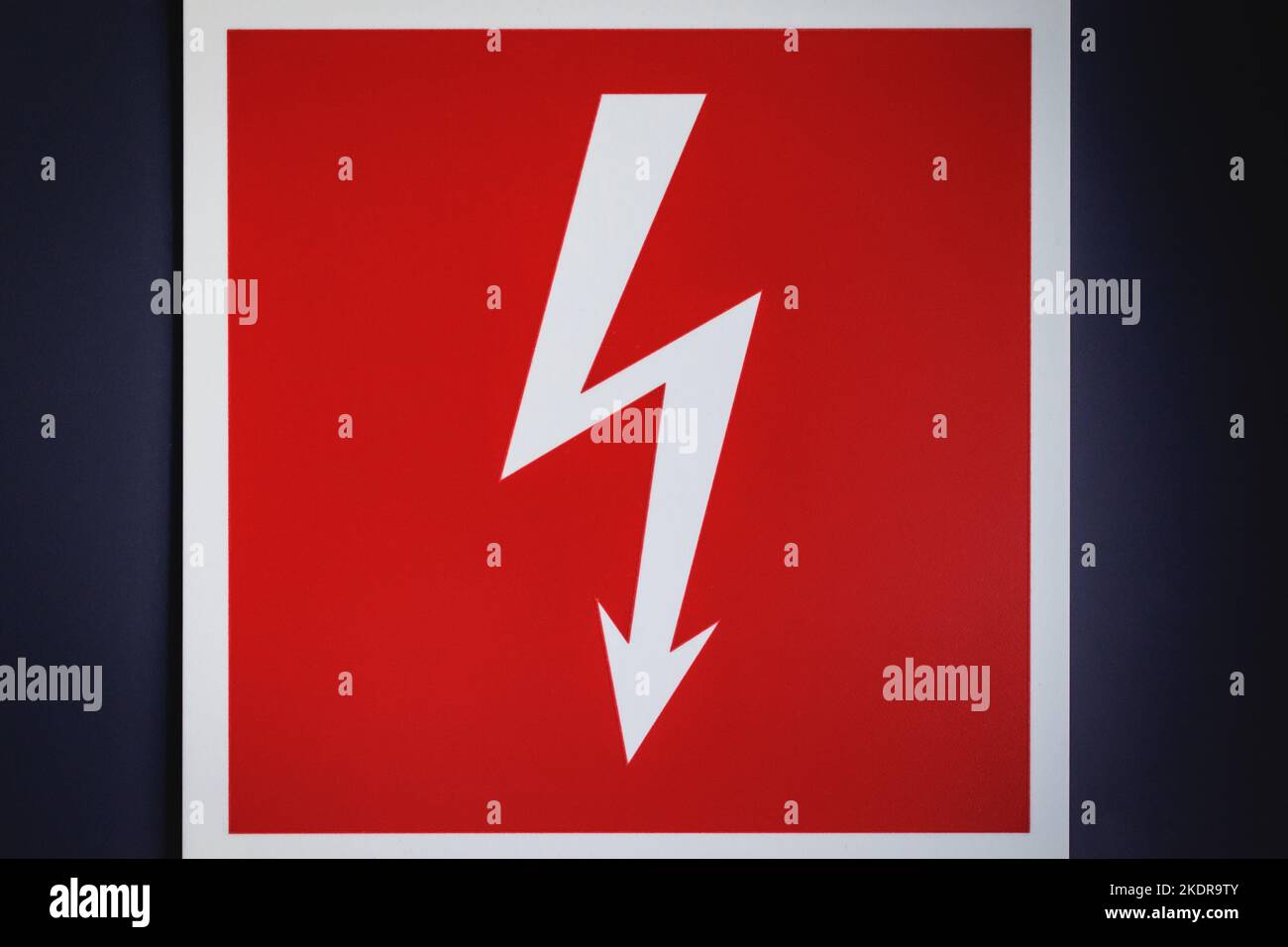 Red sign with white bolt electricity sign Stock Photo Alamy