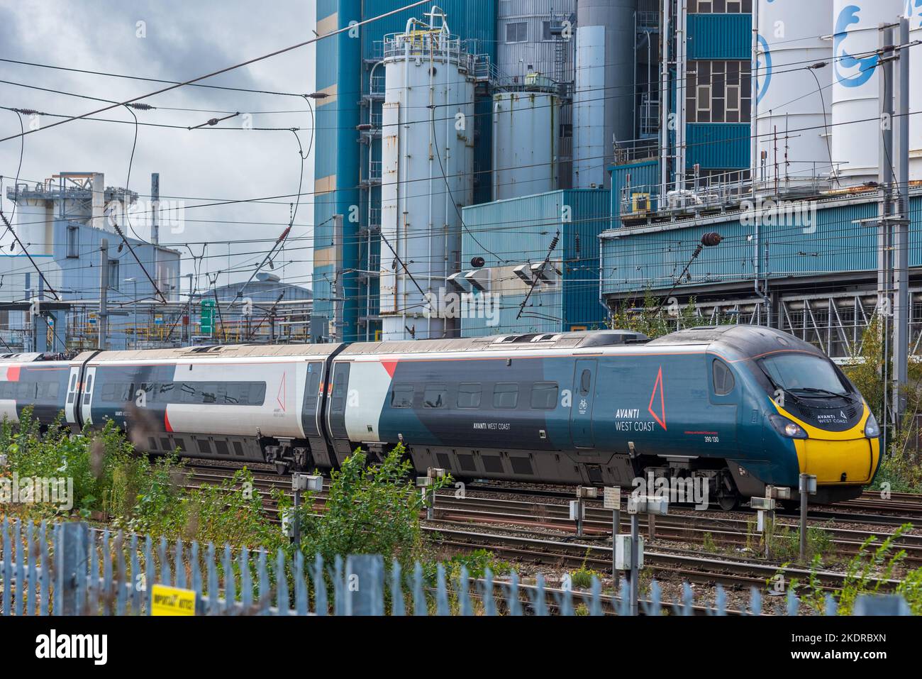 Avanti Pendolino train at Warrington Bank Quay station in front of the closed Lever Faberge factory. Stock Photo