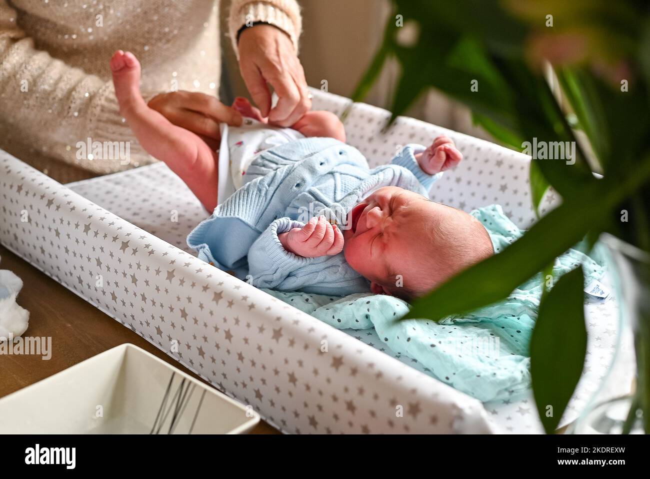 New born baby boy having a nappy change Stock Photo Alamy