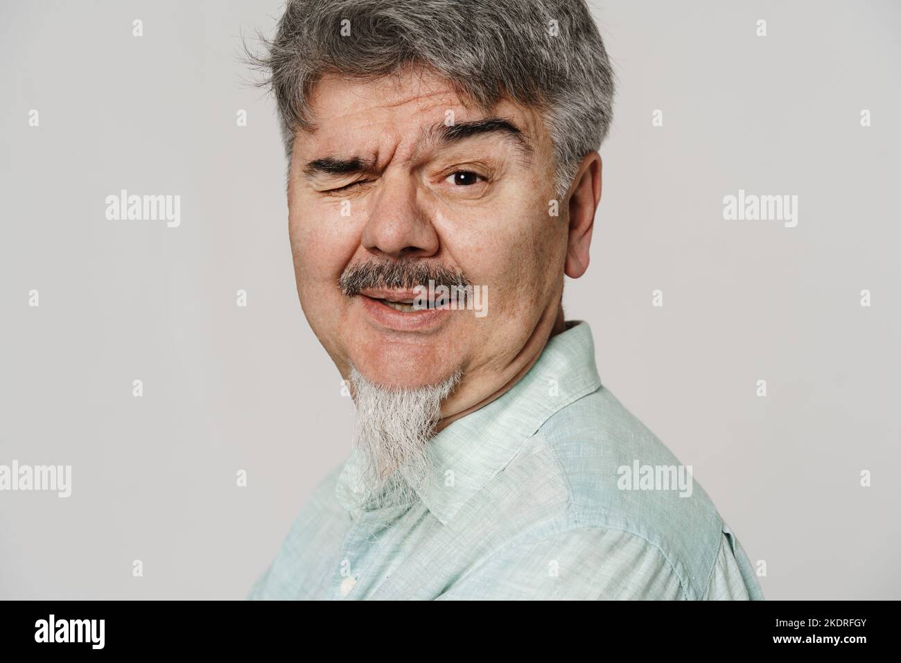 Senior man wink hi-res stock photography and images - Alamy