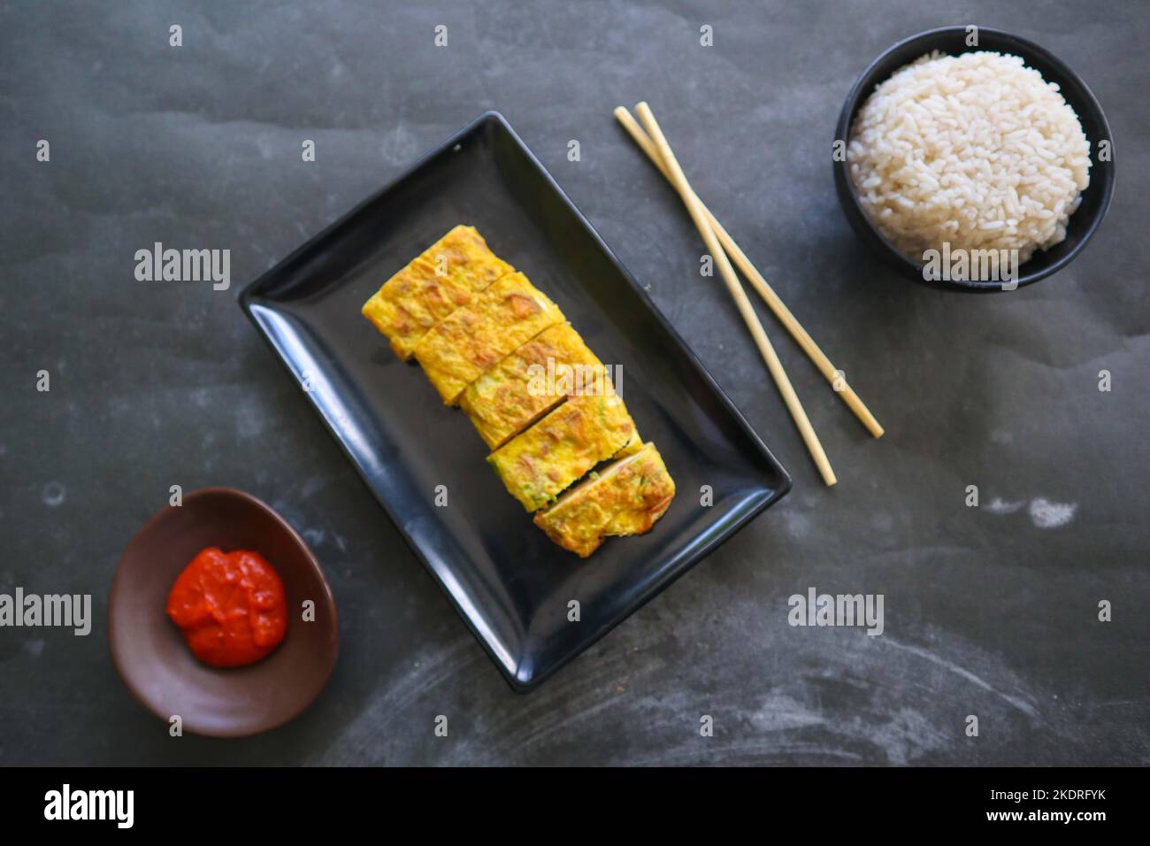 Telur dadar gulung or Tamagoyaki or Japaneses egg roll. Gyeran Mari or Korean Rolled Omelette. fried egg Stock Photo