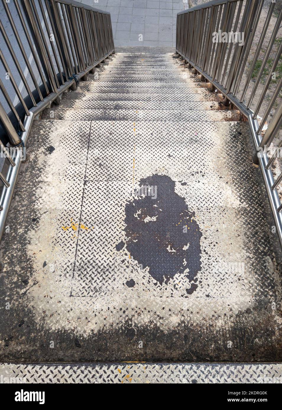 The old metal staircase with the stainless railing of the overpass in ...