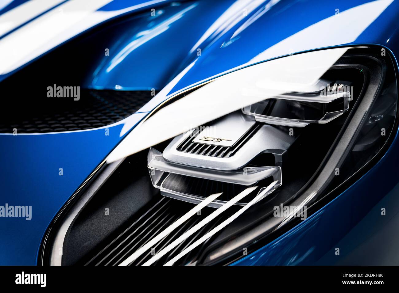 Blue Ford GT headlight with light reflection Stock Photo