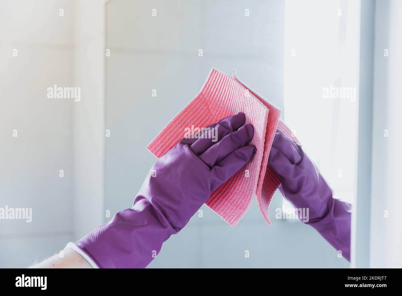 https://c8.alamy.com/comp/2KDRJT7/cropped-view-of-housekeeper-woman-hand-in-purple-rubber-gloves-polishing-mirror-with-pink-cloth-rag-cleaner-while-cleaning-bathroom-at-home-housekeeping-and-cleaning-service-clean-house-cleanliness-2KDRJT7.jpg