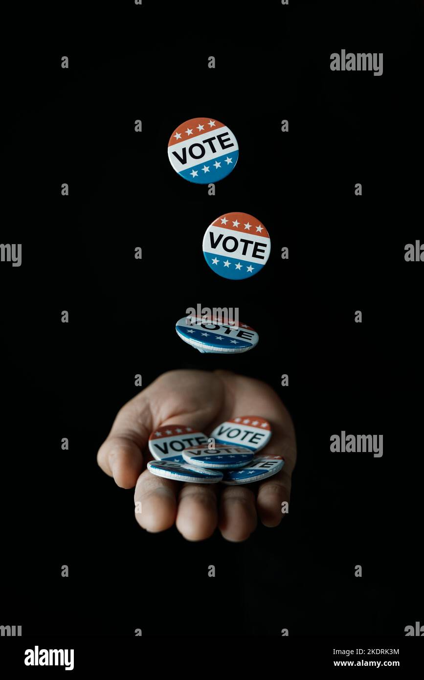 Voting Hand Signs some vote badges for the United States election falling on the hand of ...