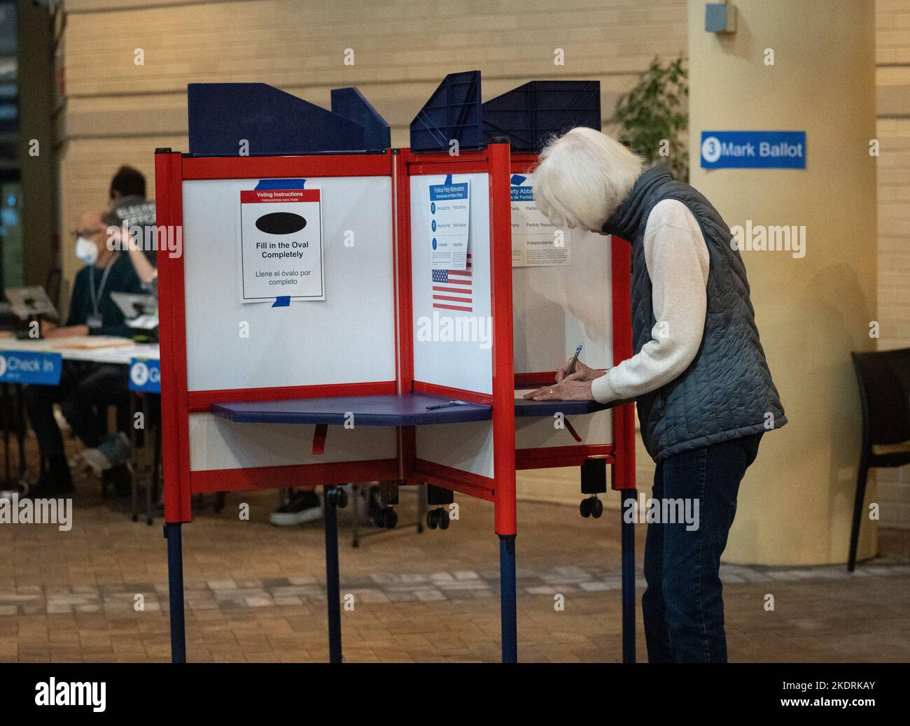 Arlington, USA. 8th Nov, 2022. A woman fills in her ballot during the U.S. midterm elections at a polling station in Arlington, Virginia, the United States, Nov. 8, 2022. Concerned voters across the United States are going to the polls to cast their ballots in the 2022 midterm elections on Tuesday amid heightened partisanship and divide. Credit: Liu Jie/Xinhua/Alamy Live News Stock Photo