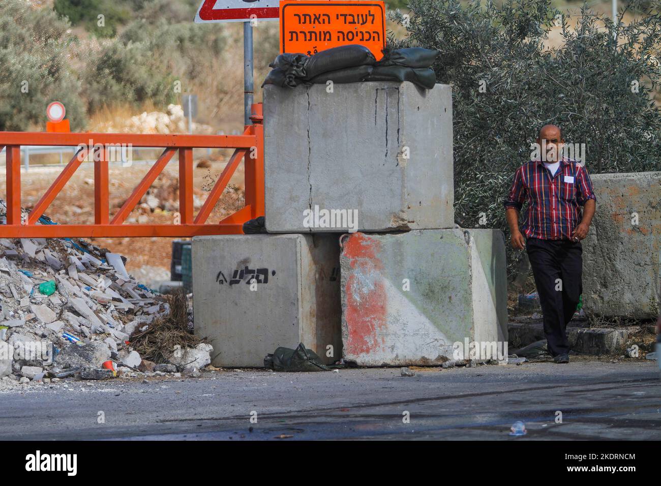Qalqilya, Palestine. 8th Nov, 2022. A Palestinian man walks past the