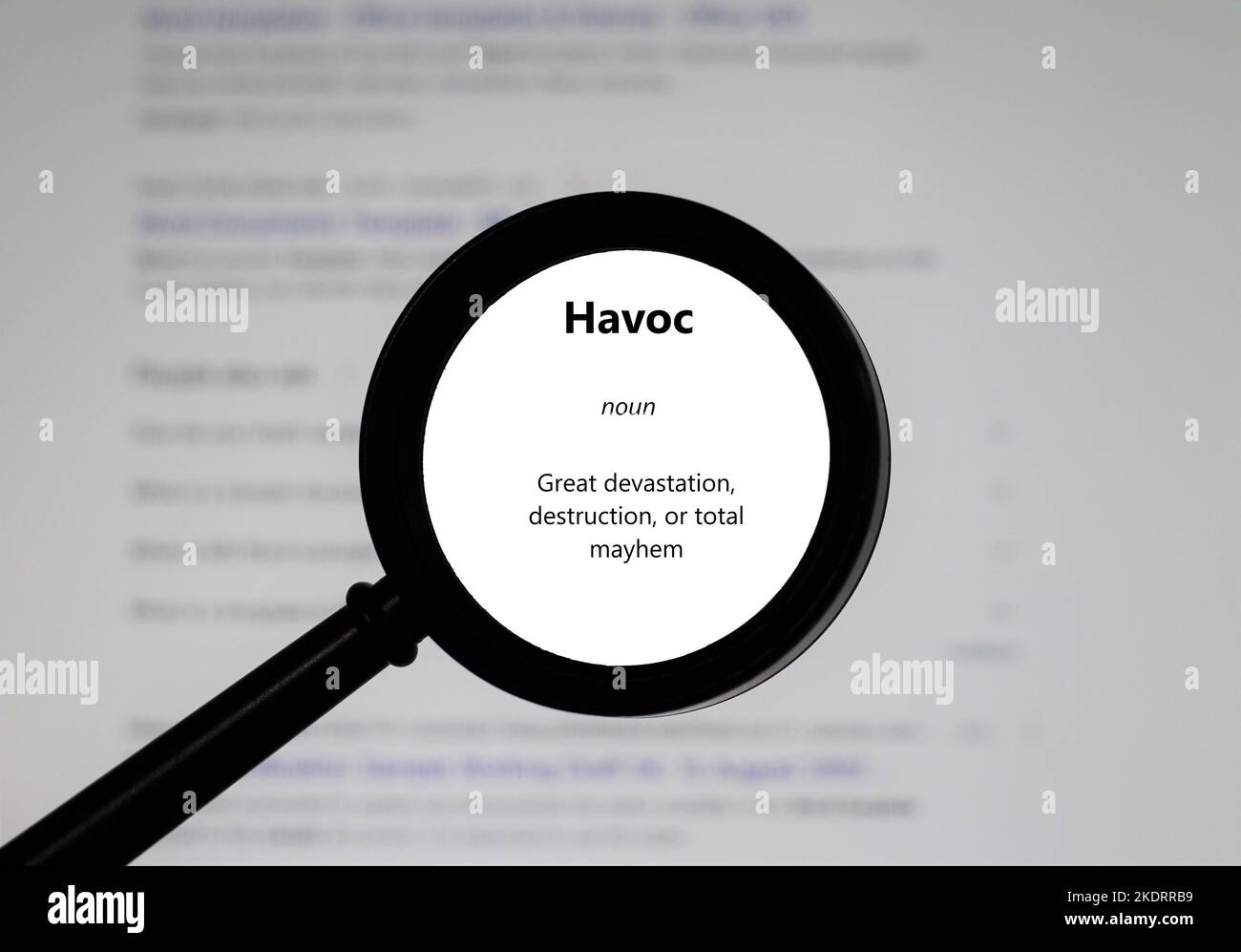 Selective focus on word Havoc, word in a dictionary. Close up of an English dictionary page with word havoc. Stock Photo