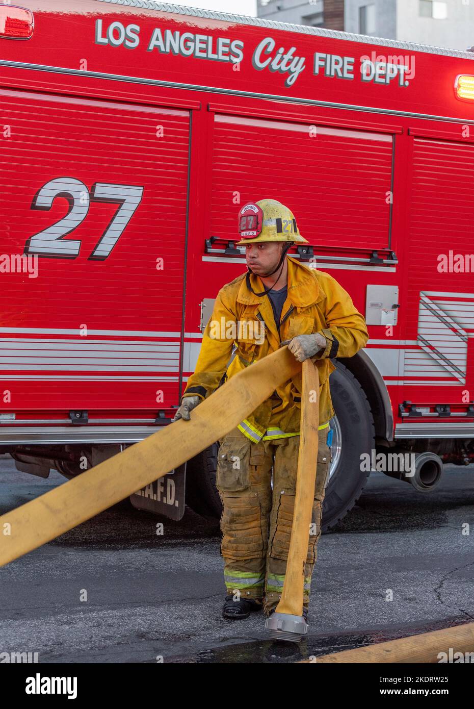 Los Angeles, CA, USA – November 3, 2022: Los Angeles Fire Department firefighters put out a house fire on Martel street in Los Angeles, CA. Stock Photo