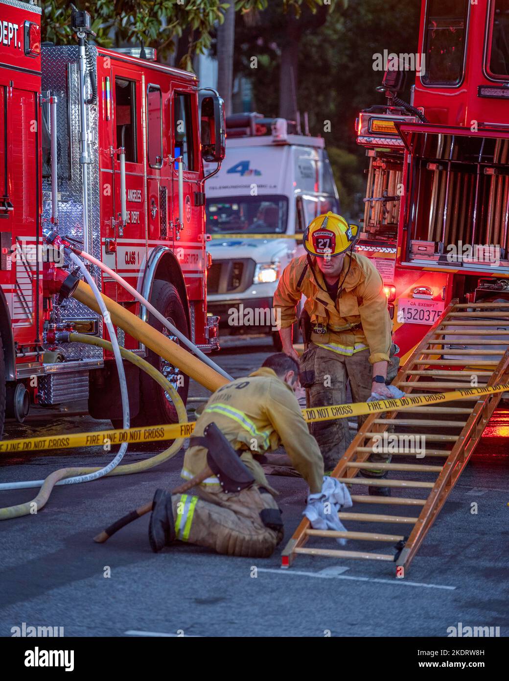 Los Angeles, CA, USA – November 3, 2022: Los Angeles Fire Department firefighters put out a house fire on Martel street in Los Angeles, CA. Stock Photo