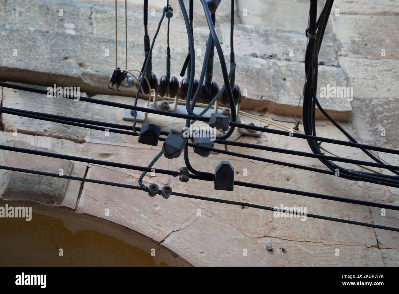 Malta electric wires hanging on building detail Stock Photo Alamy