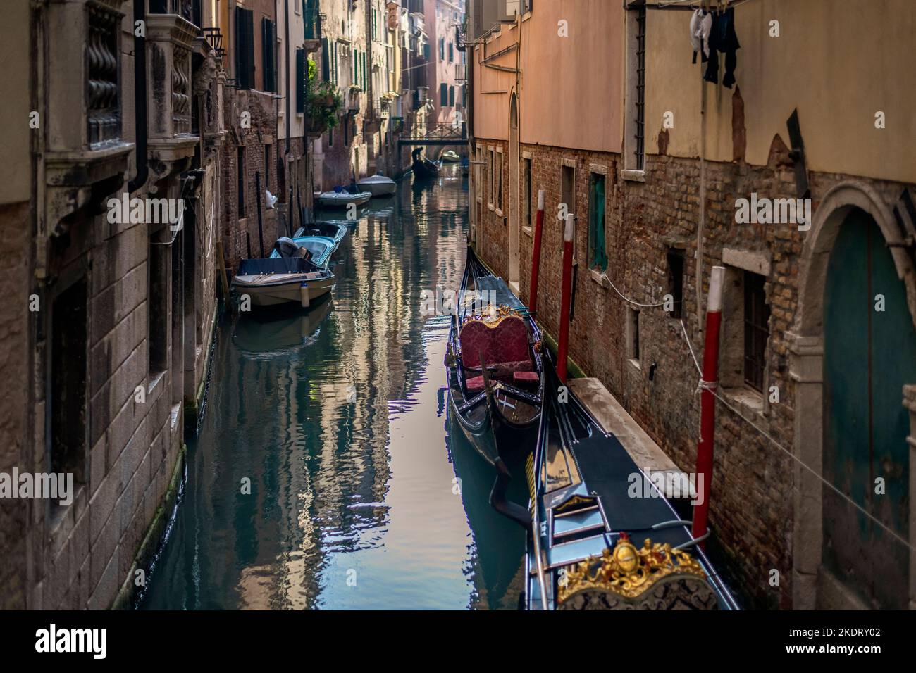 Gondolas moored on a narrow Venetian canal Stock Photo