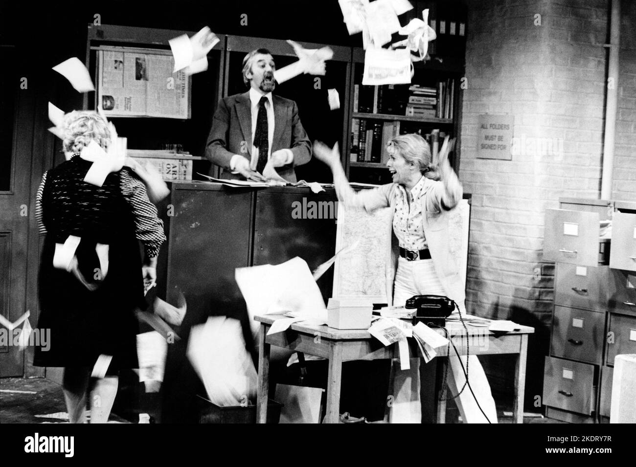centre: Bernard Gallagher (Wally)  right: Billie Whitelaw (Lucy) in ALPHABETICAL ORDER by Michael Frayn at the Hampstead Theatre Club, London NW3  11/03/1975  set design: Alan Tagg  costumes: Frances Haggett  lighting: Howard Eldridge  director: Michael Rudman Stock Photo