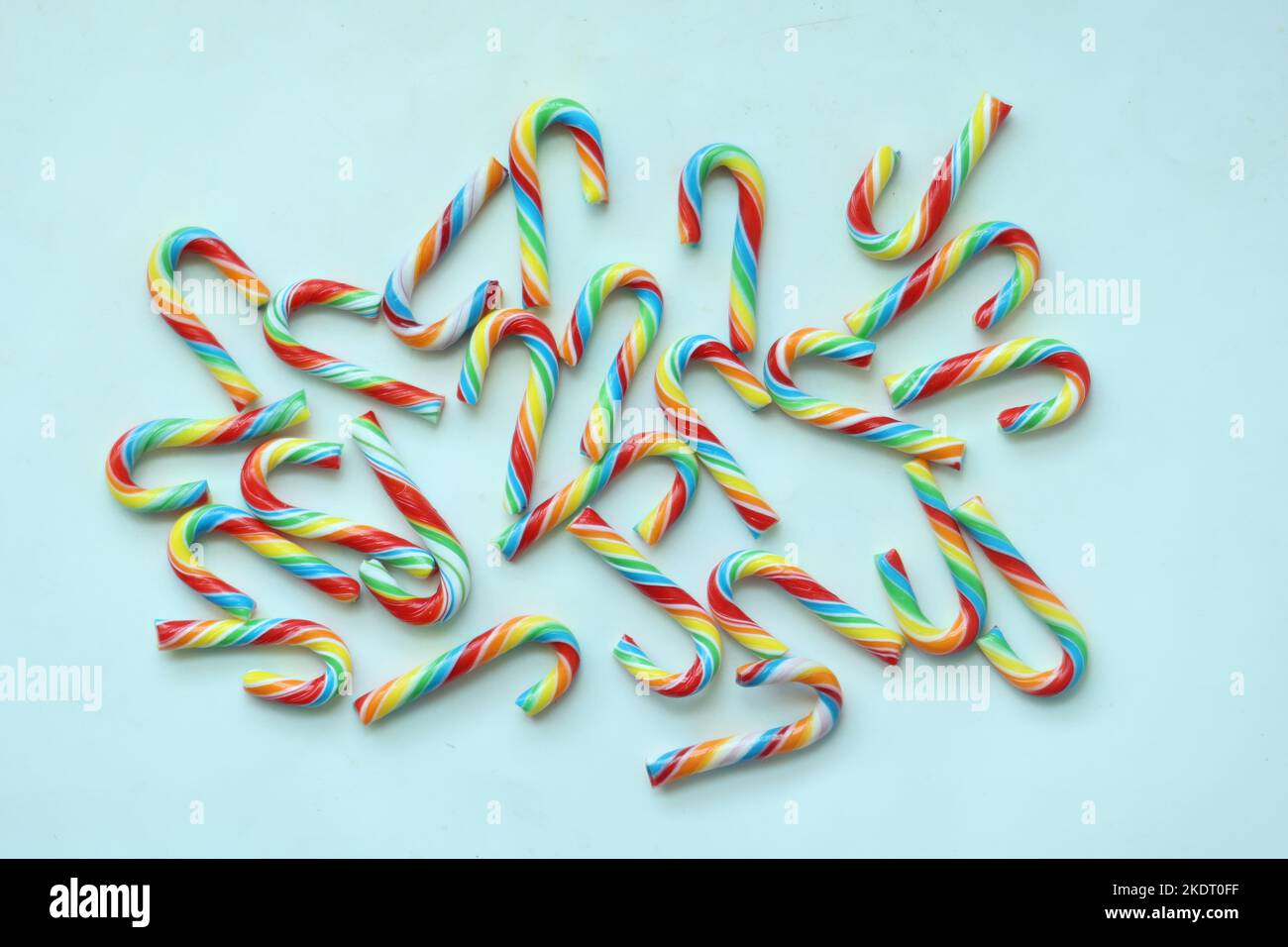 mini cherry candy canes on white background  Stock Photo