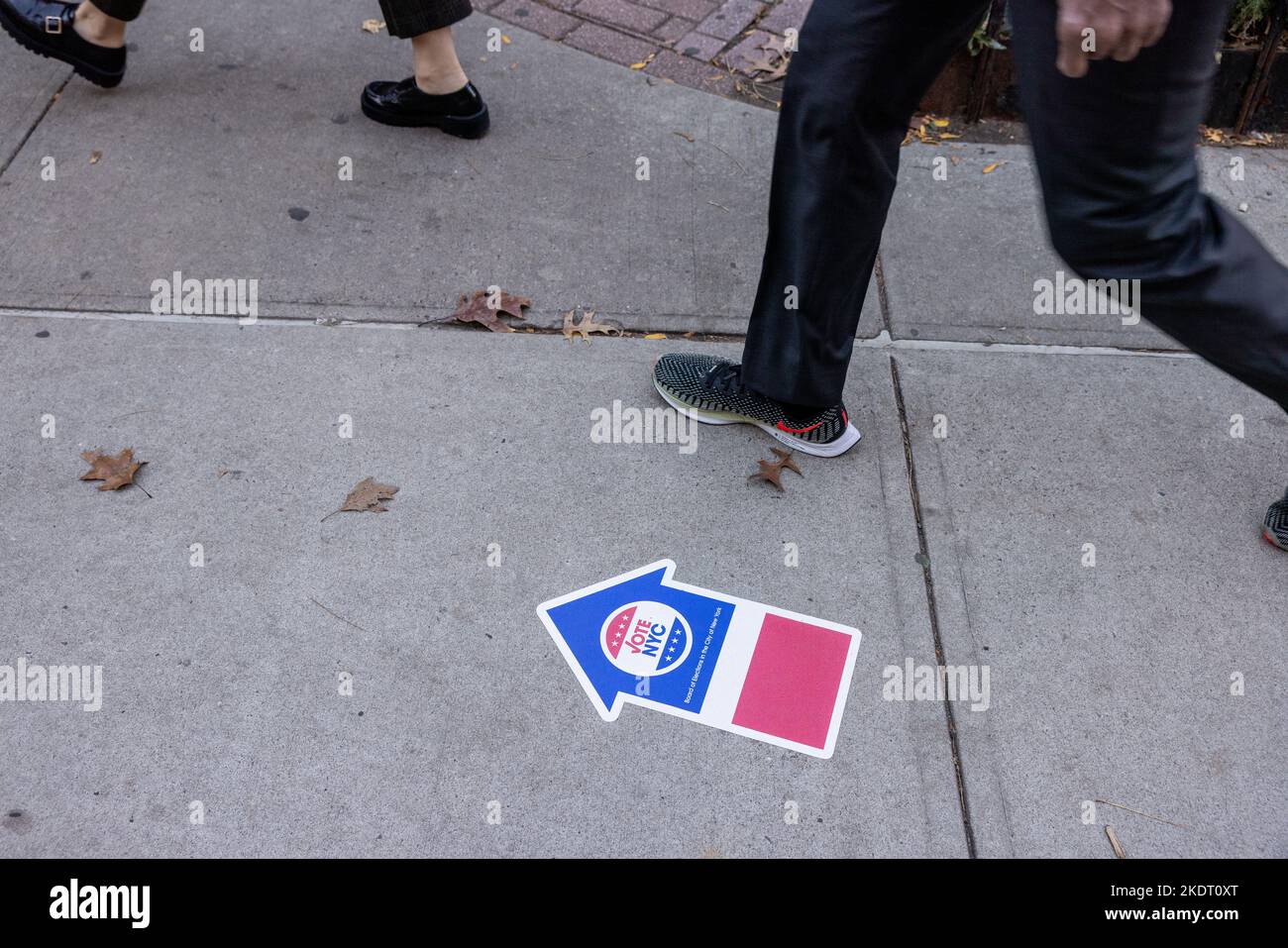 NEW YORK, N.Y. — November 8, 2022: Pedestrians walk near a polling site in Manhattan’s TriBeCa neighborhood on Election Day 2022. Stock Photo