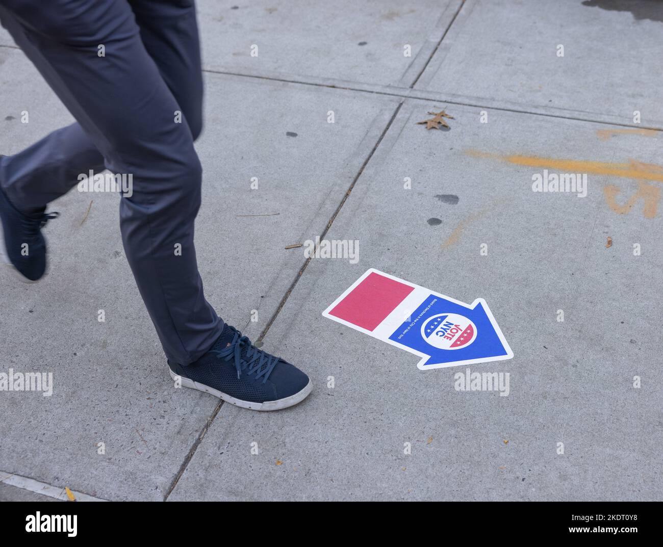 NEW YORK, N.Y. — November 8, 2022: A pedestrian walks near a polling site in Manhattan’s TriBeCa neighborhood on Election Day 2022. Stock Photo