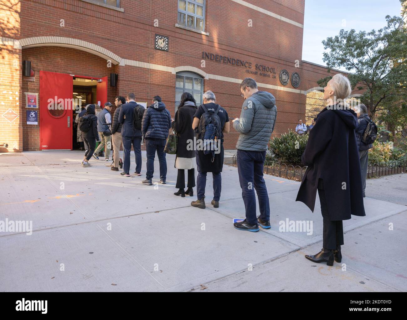 NEW YORK, N.Y. — November 8, 2022: Voters line up outside a polling site in Manhattan’s TriBeCa neighborhood on Election Day 2022. Stock Photo