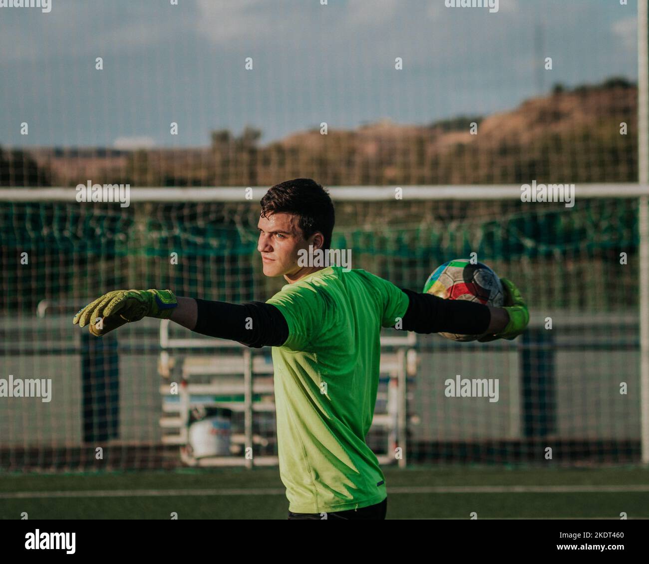 Vertical portait of a goalie throwing a soccer ball Stock Photo Alamy