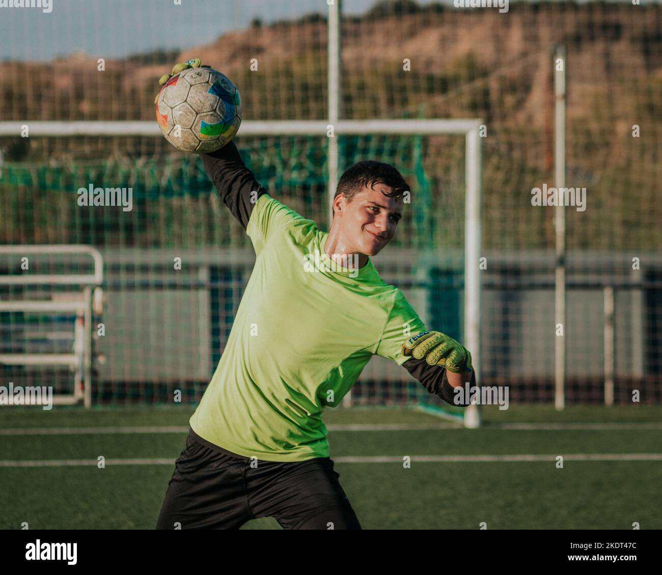 Vertical portait of a goalie throwing a soccer ball Stock Photo Alamy