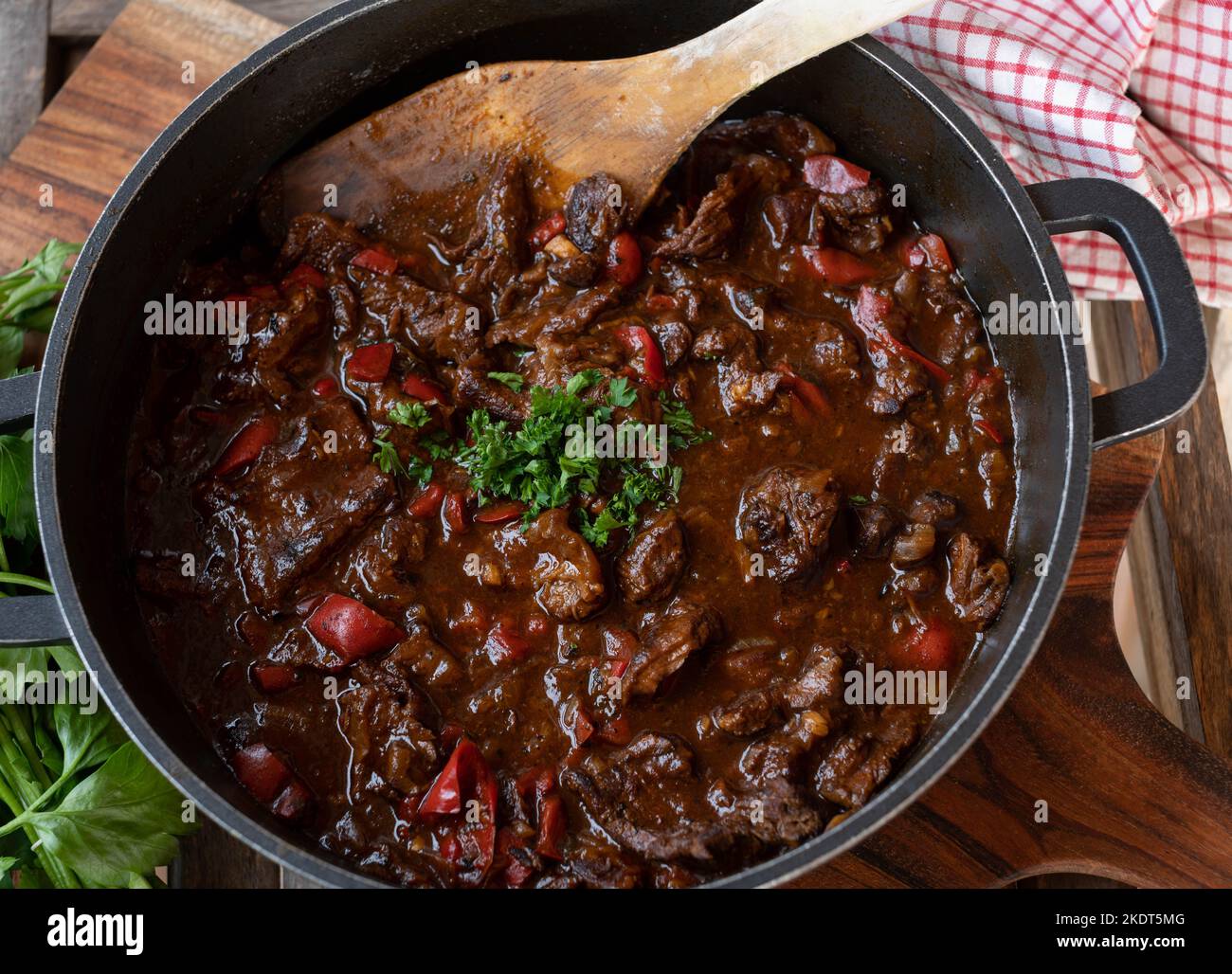 Beef stew with bell peppers, onions, garlic, tomtoes and herbs in a