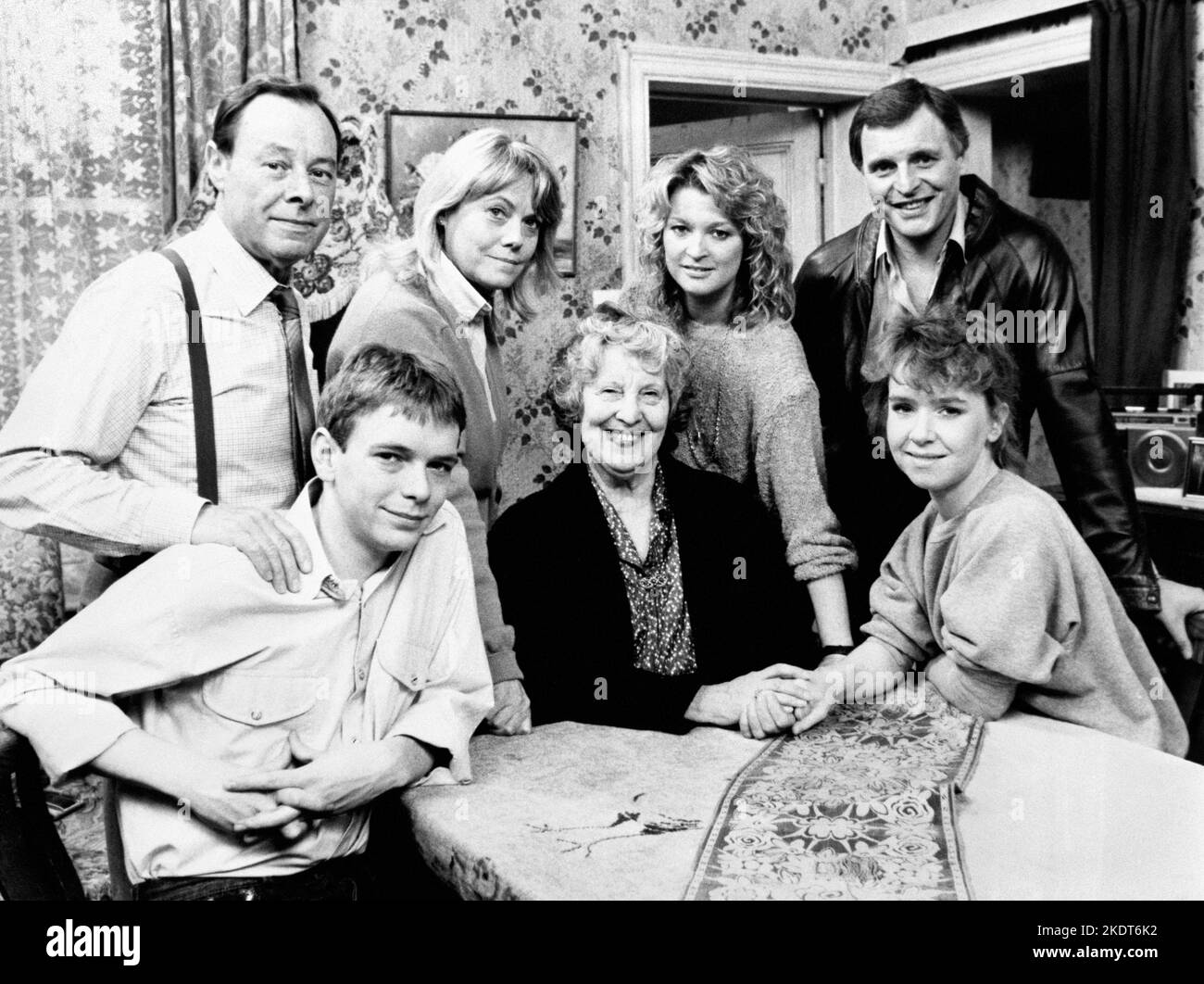 File photo dated 29/07/88 of a 'Family Album' gathering to mark the passing of Lou Beale, matriarch of Albert Square and Britain's favourite television granny, who 'has died peacefully in her sleep' so that actress Anna Wing couldwithdraw from the cast of the BBC-1 top-rated serial to work on other projects. Lou is seated with Ian (Adam Woodyatt) and Michelle (Susan Tully). Standing are, from left: Arthur (played by Bill Treacher); Pauline (played by Wendy Richard), Kathy (played by Gillian Taylforth) and Pete (played by Peter Dean). Mr Treacher, who played Arthur Fowler in EastEnders, has die Stock Photo