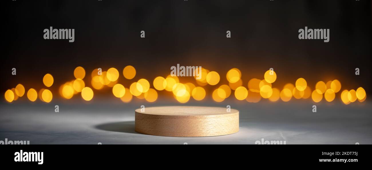 Cylinder wooden podium with Christmas bokeh lights Stock Photo
