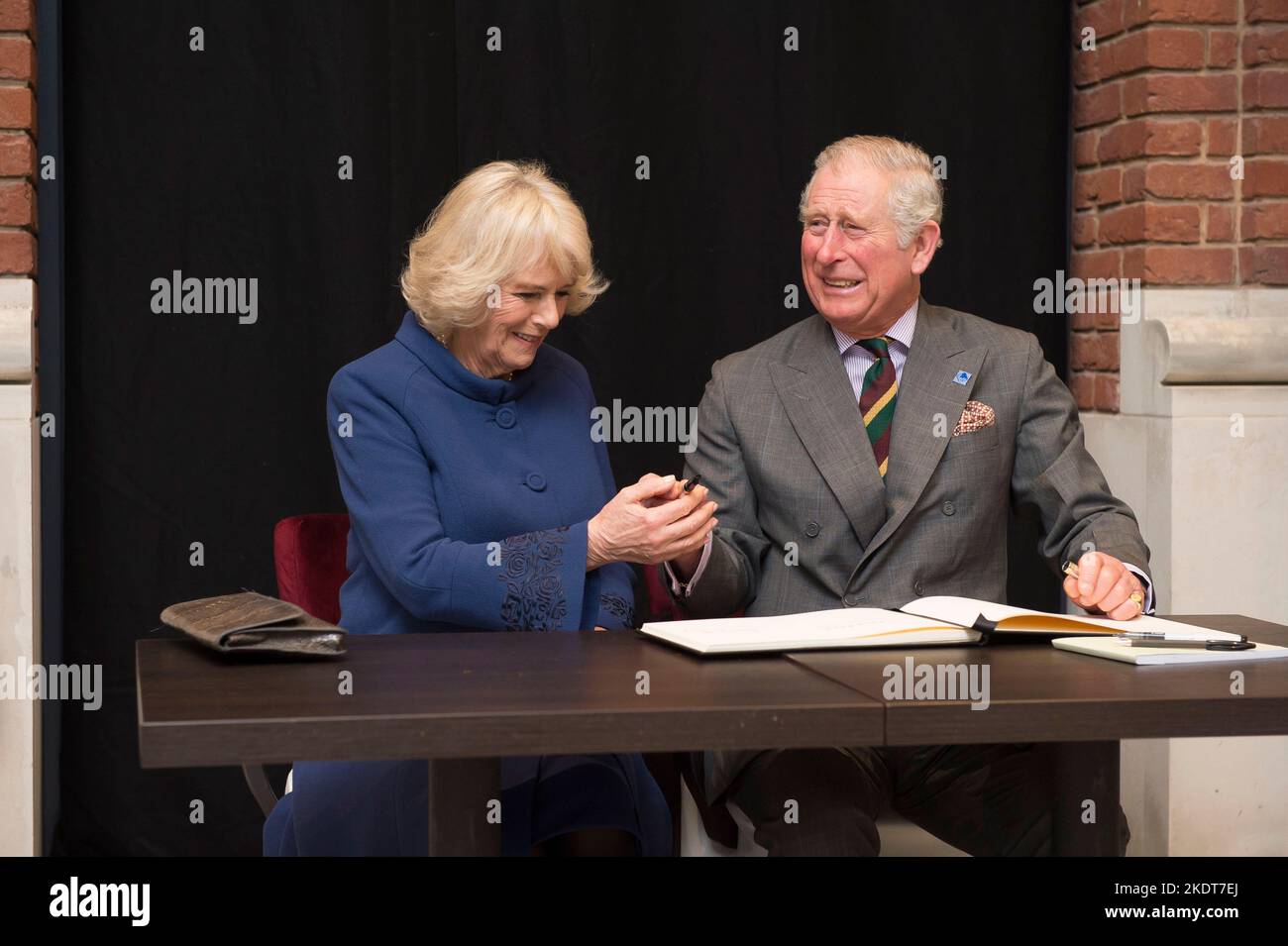 King Charles visiting Hull, UK, in February 2017 when he was Prince of Wales.He is pictured having issues with a pen while signing a visitors book wit Stock Photo